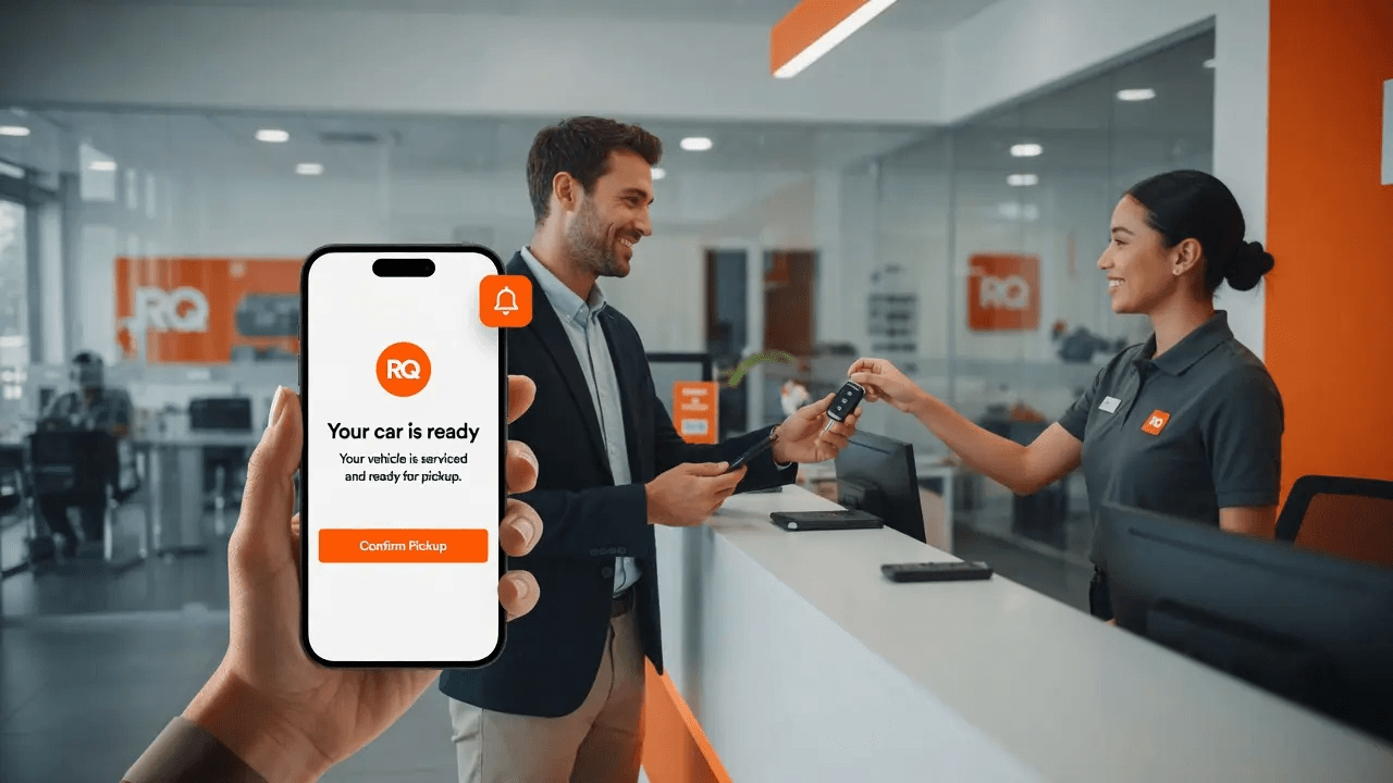 Customer receiving car keys at a service desk while their phone shows a “your car is ready” message